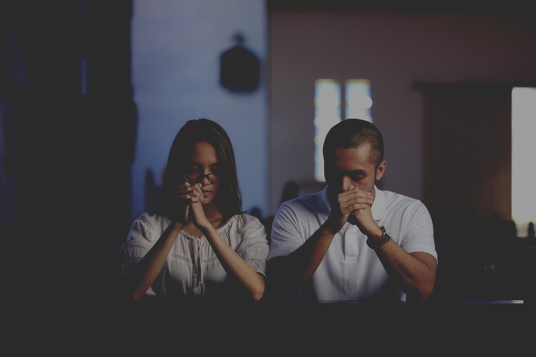 Couple Praying at a Church